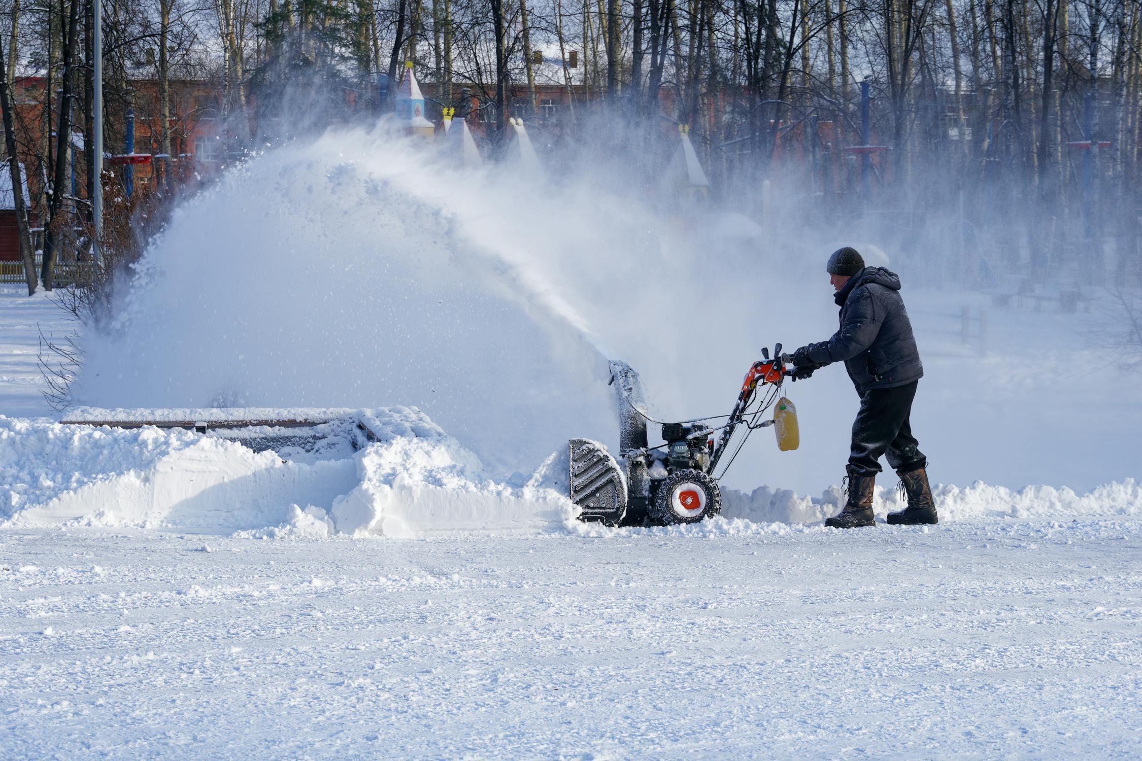 Reconnect the spark plug and start the snowblower to ensure it runs smoothly (Source: Pexels)