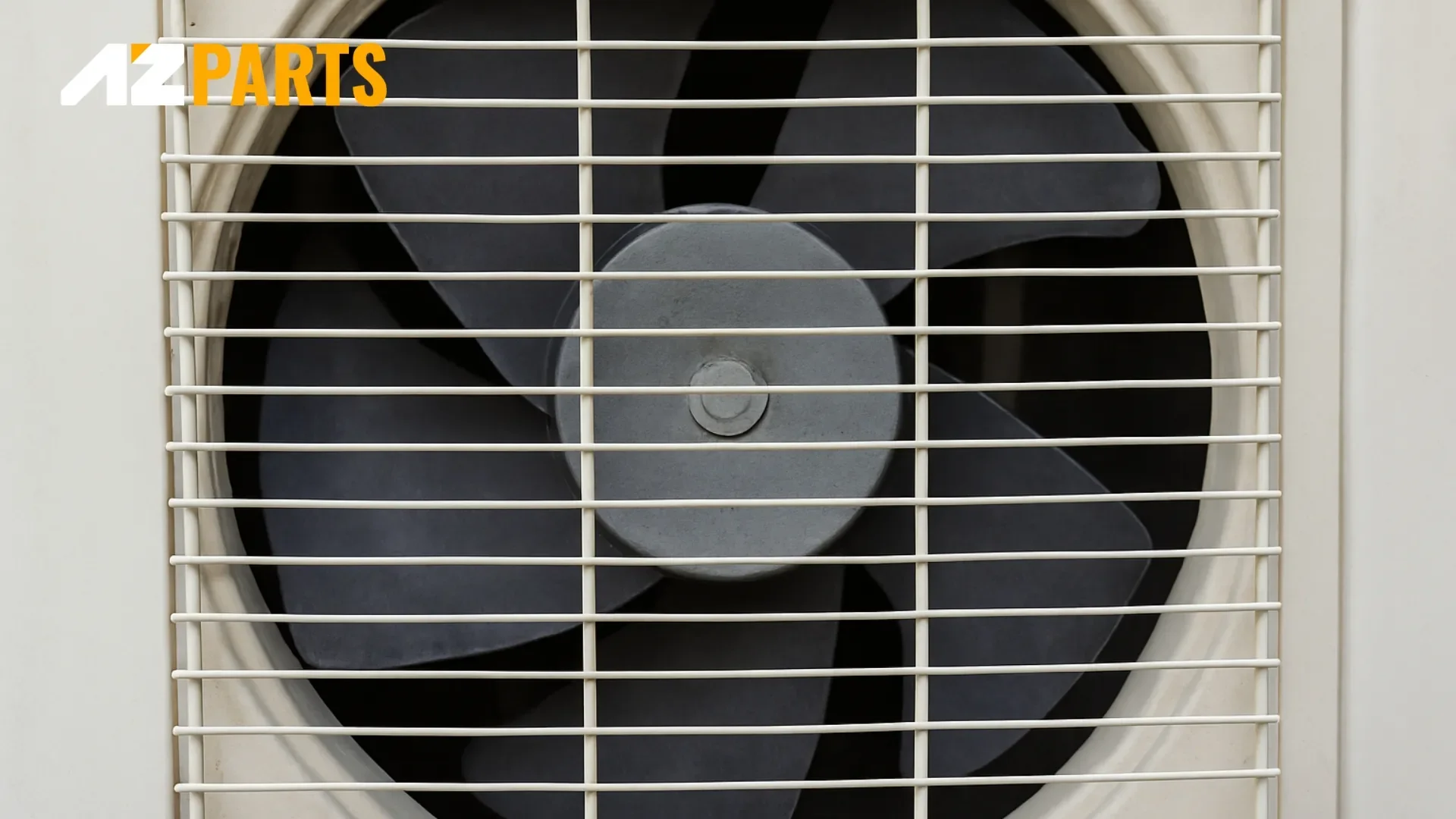 Close-up of an AC fan behind protective grille – no motion or sound from the compressor